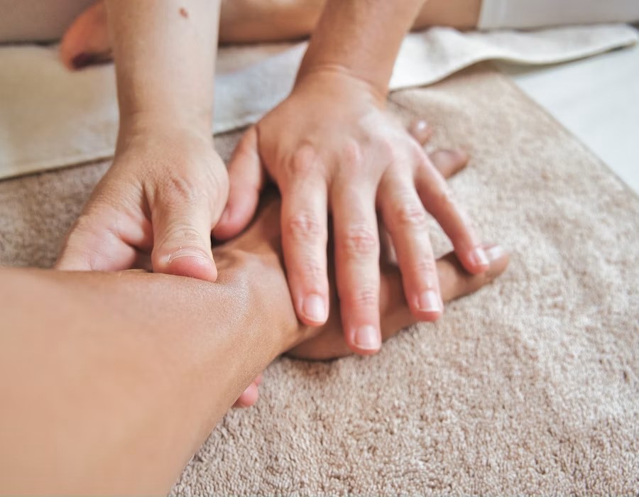 Calm, softly lit space representing a gentle Ortho-Bionomy therapy session